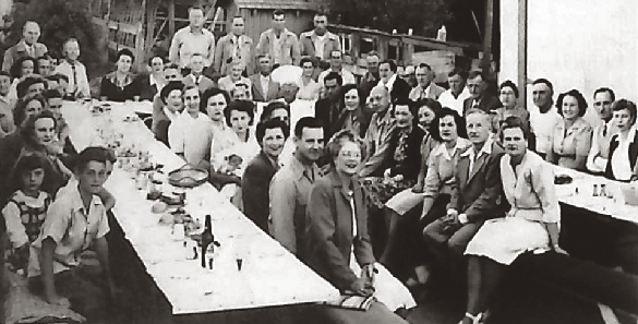 Black and white group photo of Cal Water employees at a company barbecue in the 1940s