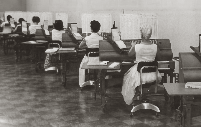 Black and white photo of women working in Cal Water billing office in the 1940s