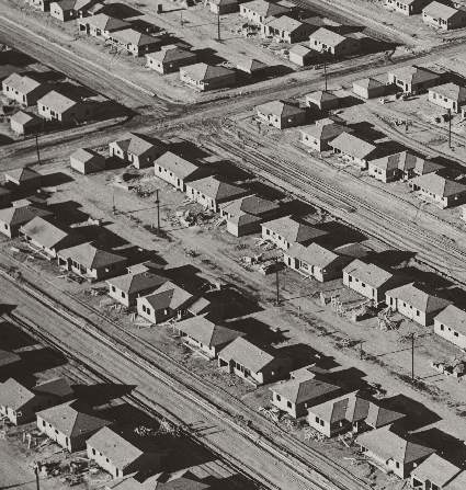 Aerial black and white photo of post-WWII housing developments in California